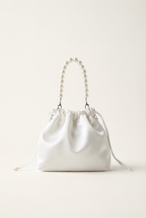 bolso comunión niña, bolso elegante comunión, bolso blanco comunión, bolso con perlas, bolso ceremonia niña, accesorios comunión, bolso niña elegante, bolso fiesta infantil