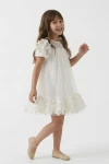 Vestido Romy Blanco Crema – vista trasera con lazo decorativo