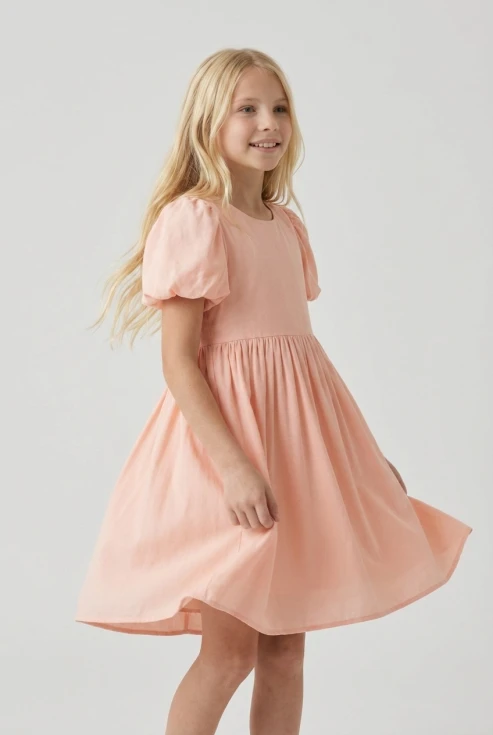 Vestido con manga farol Sia rosa para niña, vista frontal con la falda en movimiento