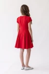 Vestido Rumi rojo de espaldas: cremallera y fruncido en los laterales de la falda